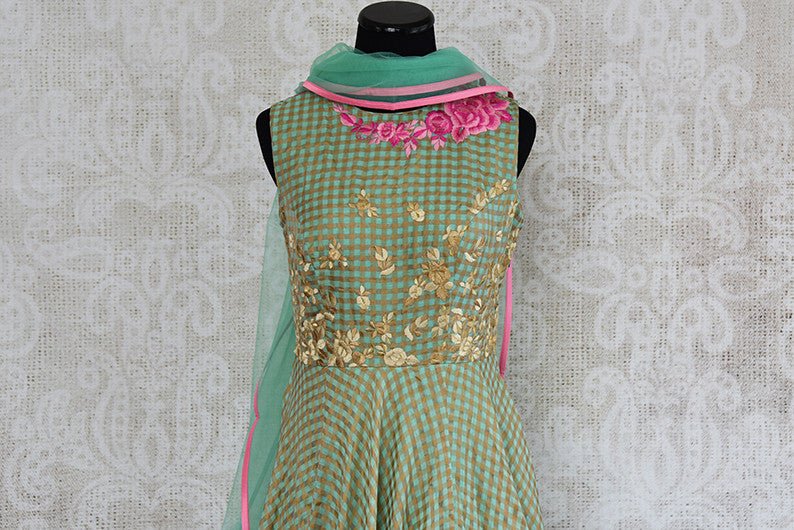 Green chanderi silk anarkali with thread embroidery on bodice. Perfect elegant and classy dress for parties.- top embroidered view