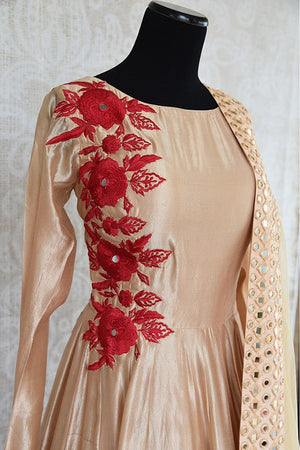 Beige silk suit with beautiful red thread embroidery on front and back and full mirror work dupatta.-embroidery close up