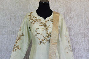 Off white silk embroidered anarkali with net dupatta. Classy addition in ethnic wardrobe.-front bodice