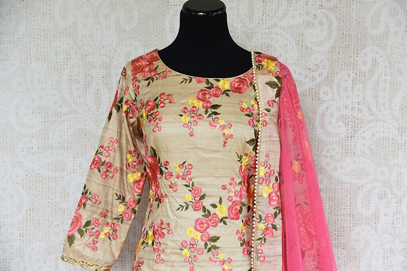 Designer beige floral heavy thread work embroidery suit with yellow banarasi palazzo . Perfect in Indian Parties.-top view