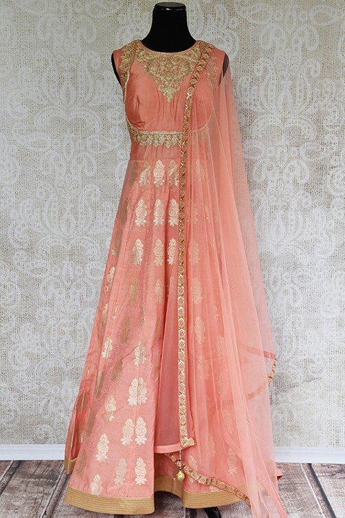 Designer Indian peach anarkali suit with gold embroidery. This comes with net dupatta . Party perfect.-full view