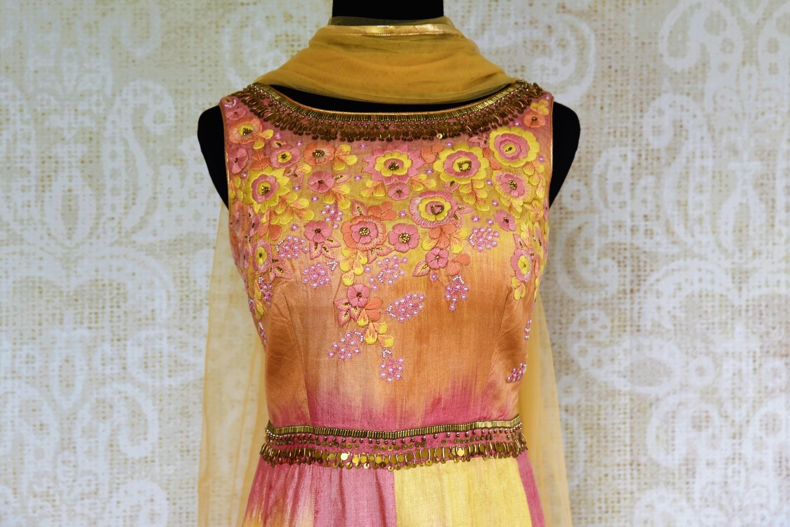 Buy yellow and pink silk embroidered Anarkali suit online from Pure Elegance with dupatta. Our fashion store brings stunning Indian Anarkali suits in USA for women.-top