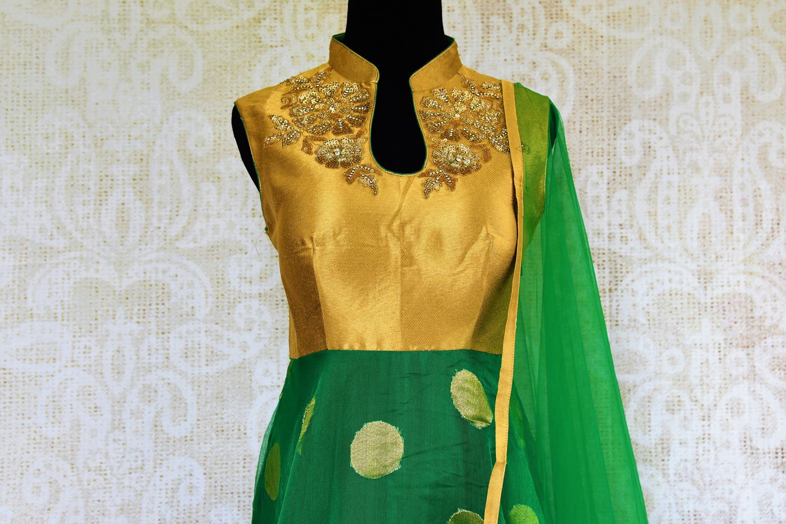 Buy green and gold jute Banarasi embroidered Anarkali suit online in USA. Browse through a stunning range of Indian Anarkali suits at Pure Elegance online store.-top front