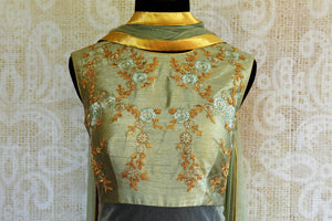 Buy green chanderi silk Anarkali suit online in USA. Pure Elegance clothing store brings an exquisite range of Indian designer Anarkali suits online in USA. Shop online-top front
