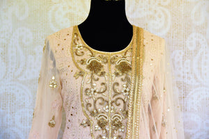 Buy off white Lucknowi embroidered kurta with skirt online in USA with dupatta. Pure Elegance fashion store brings an exclusive range of Indian dresses in USA for women.-top front