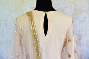 Buy off white Lucknowi embroidered kurta with skirt online in USA with dupatta. Pure Elegance fashion store brings an exclusive range of Indian dresses in USA for women.-top back