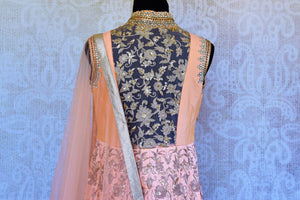 Buy peach raw silk embroidered Anarkali suit online in USA with dupatta. Pure Elegance fashion store brings an exclusive range of Indian Anarkali suits in USA for women.-top back