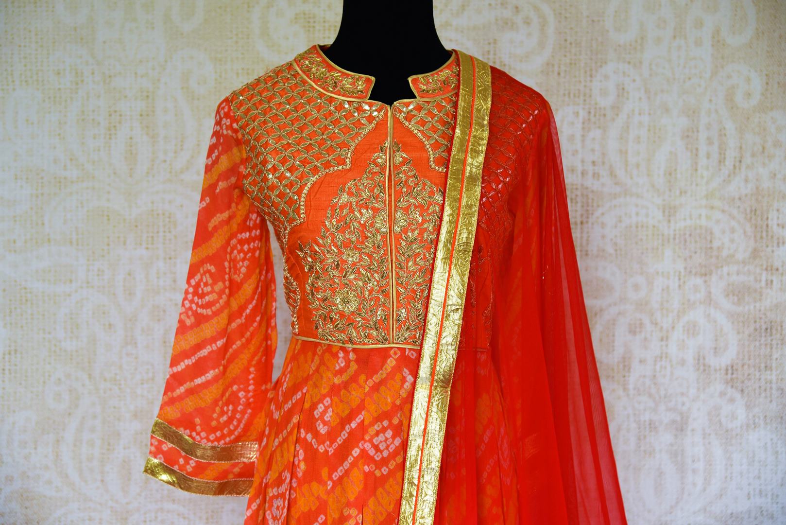 Buy orange bhandej gota patti Anarkali suit online in USA with dupatta. Pure Elegance store brings a stunning range of ethnic Indian Anarkali suits in USA for every occasion.-top front