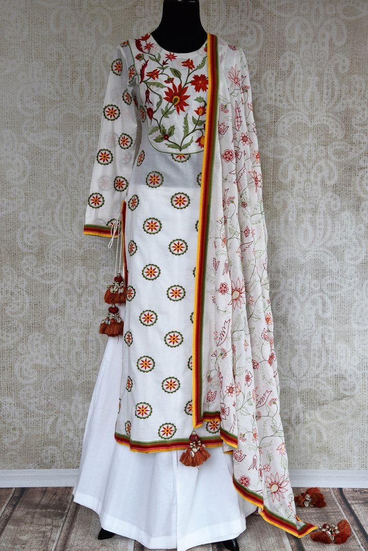 Buy white embroidered linen sharara set online at USA at Pure Elegance Indian fashion store. Find your stylish Indian designer dresses in exquisite designs for women.-full view