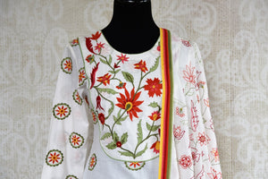 Buy white embroidered linen sharara set online at USA at Pure Elegance Indian fashion store. Find your stylish Indian designer dresses in exquisite designs for women.-top