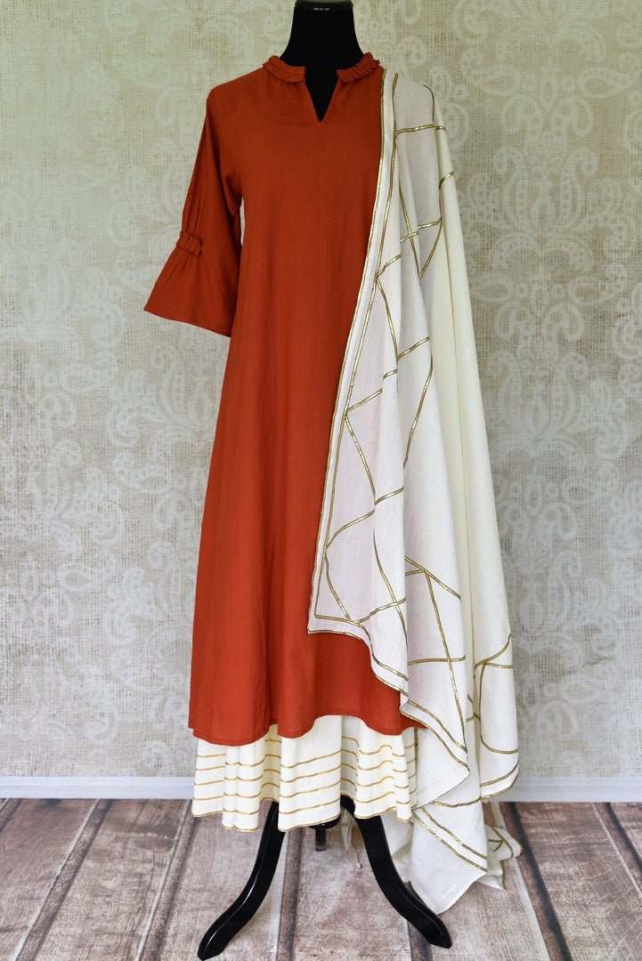 Buy rust orange linen kurta with white palazzo online in USA and dupatta from Pure Elegance Indian fashion store in USA. Make a stylish fashion statement this summer with a range of exquisite Indian designer dresses available online and at our clothing store in USA. Shop now.-full view
