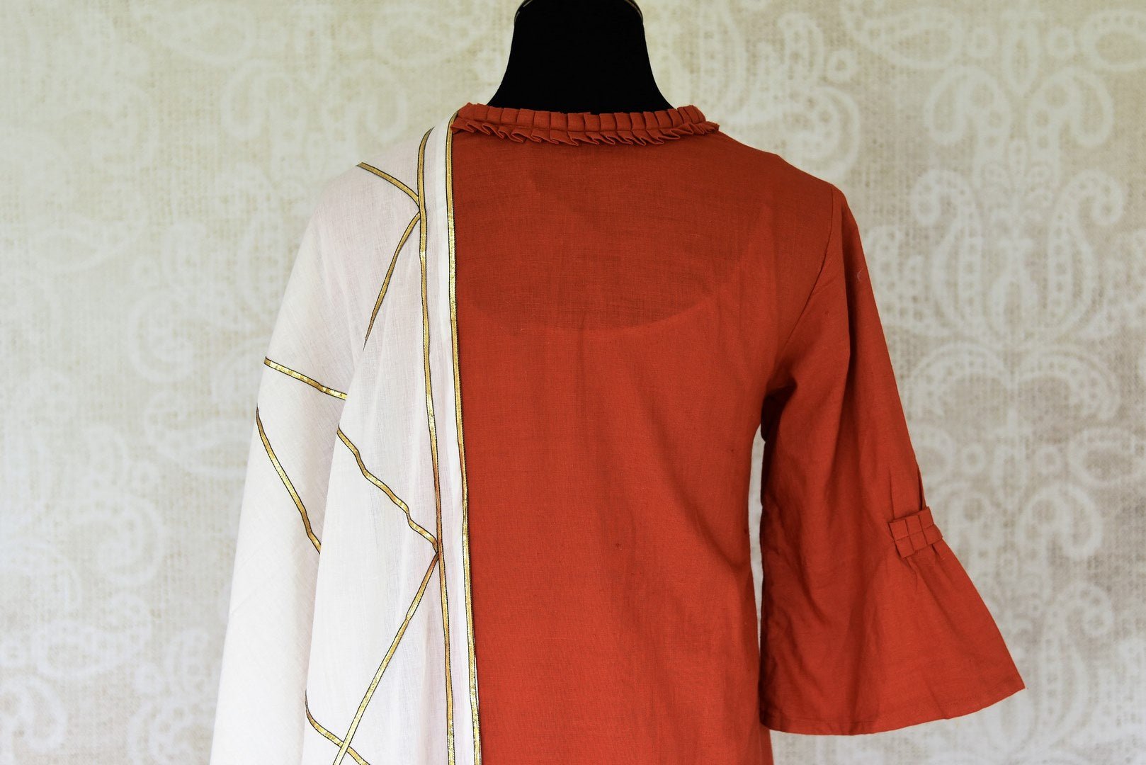 Buy rust orange linen kurta with white palazzo online in USA and dupatta from Pure Elegance Indian fashion store in USA. Make a stylish fashion statement this summer with a range of exquisite Indian designer dresses available online and at our clothing store in USA. Shop now.-back