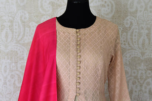 Sheer sophistication comes with muted tones and simplistic designs like this beige chanderi silk floor-length anarkali suit. The self-textured suit comes with a rich red silk dupatta to add oodles of charm. Shop designer salwar suits, lehenga sets, Indian dresses online or visit Pure Elegance store, USA.-kurta front