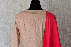 Sheer sophistication comes with muted tones and simplistic designs like this beige chanderi silk floor-length anarkali suit. The self-textured suit comes with a rich red silk dupatta to add oodles of charm. Shop designer salwar suits, lehenga sets, Indian dresses online or visit Pure Elegance store, USA.-kurta back