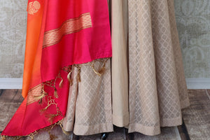 Sheer sophistication comes with muted tones and simplistic designs like this beige chanderi silk floor-length anarkali suit. The self-textured suit comes with a rich red silk dupatta to add oodles of charm. Shop designer salwar suits, lehenga sets, Indian dresses online or visit Pure Elegance store, USA.-bottom