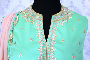 Beautiful green embroidered silk kurta palazzo set buy online in USA. The traditional dress is perfect for an alluring Indian look at special occasions. Buy more such Indian party dresses in USA at Pure Elegance, visit our exclusive clothing store in USA or shop online.-neckline