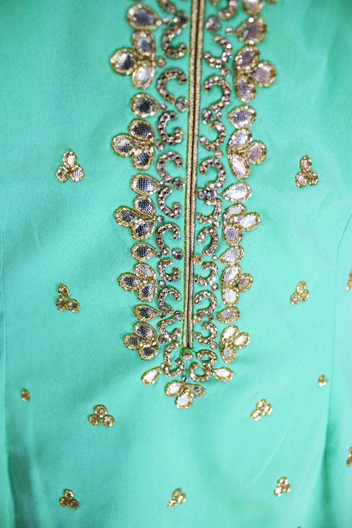 Beautiful green embroidered silk kurta palazzo set buy online in USA. The traditional dress is perfect for an alluring Indian look at special occasions. Buy more such Indian party dresses in USA at Pure Elegance, visit our exclusive clothing store in USA or shop online.-details