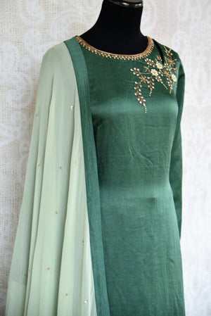 Buy beautiful embroidered green chanderi kurta with palazzo online in USA. The attire is beautifully adorned with kundan work which makes it so exquisite. Get floored by an exclusive collection of Indian formal dresses in USA available at Pure Elegance clothing store or shop online.-side view