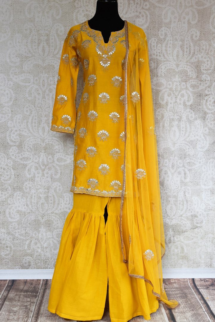 Buy yellow gota patti embroidery sharara suit with dupatta online in USA. The traditional outfit is a stunning choice for parties and special occasions. Get floored by an exclusive collection of Indian designer suits in USA available at Pure Elegance clothing store or shop online.-full view