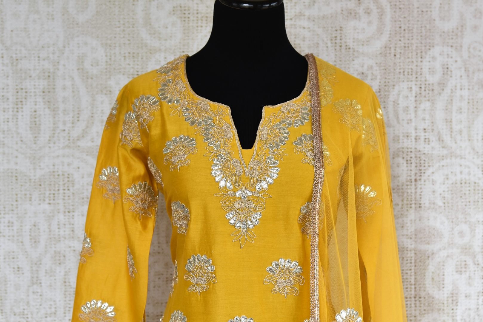 Buy yellow gota patti embroidery sharara suit with dupatta online in USA. The traditional outfit is a stunning choice for parties and special occasions. Get floored by an exclusive collection of Indian designer suits in USA available at Pure Elegance clothing store or shop online.-front