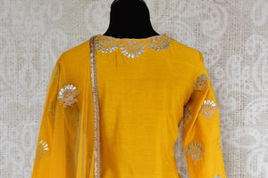 Buy yellow gota patti embroidery sharara suit with dupatta online in USA. The traditional outfit is a stunning choice for parties and special occasions. Get floored by an exclusive collection of Indian designer suits in USA available at Pure Elegance clothing store or shop online.-back