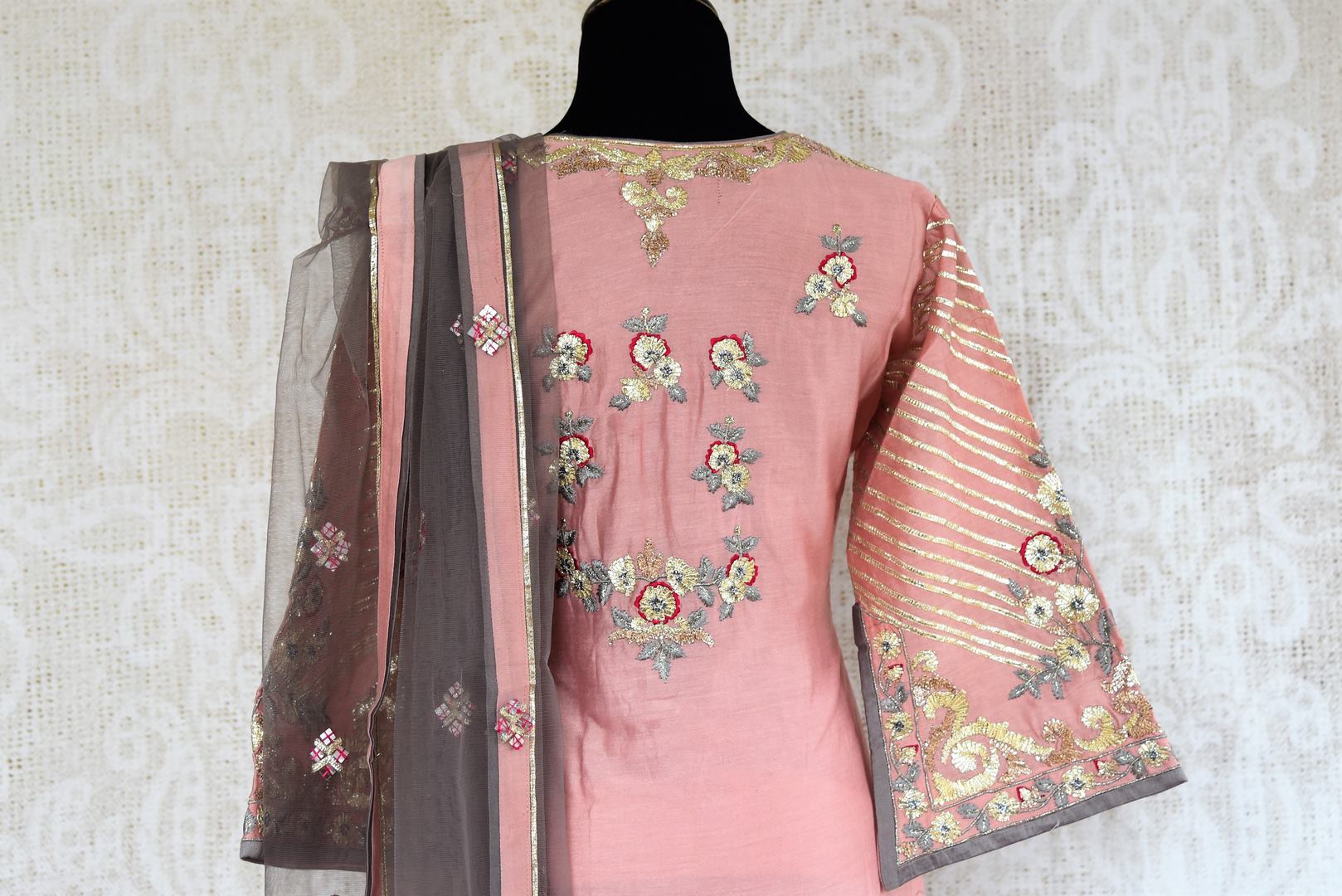 Buy pink gota pattu embroidery chanderi suit with palazzo online in USA. Radiate ethnic elegance at special occasions with this absolutely striking Indian attire. Add more such traditional Indian designer suits to your wardrobe, available at Pure Elegance clothing store in USA for women or you can also shop online. -back