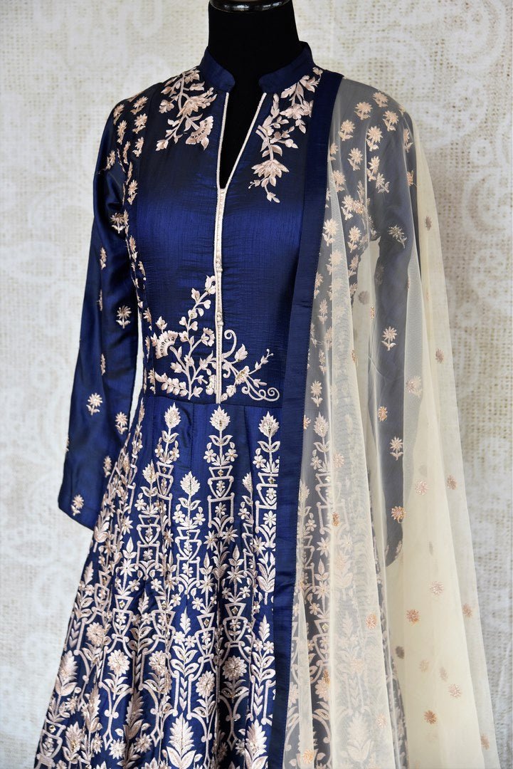 Buy royal blue embroidered floor length Anarkali suit online in USA. The beautiful ensemble is a stunning choice for weddings and parties. Get floored by an exquisite collection of Indian wedding dresses in USA available at Pure Elegance clothing store or shop online.-side view