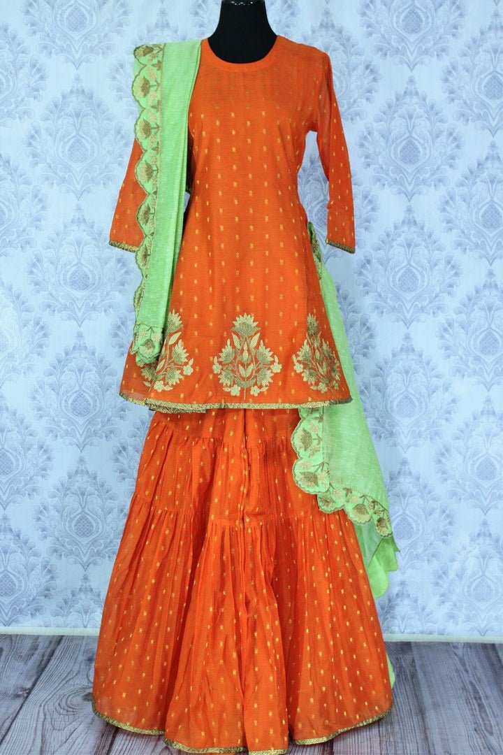Bright orange embroidered sharara suit with dupatta for online shopping in USA. A beautiful choice for a striking ethnic Indian look at special occasions. Add latest Indian designer dresses to your ethnic wardrobe available at Pure Elegance Clothing store in USA for women.-full view