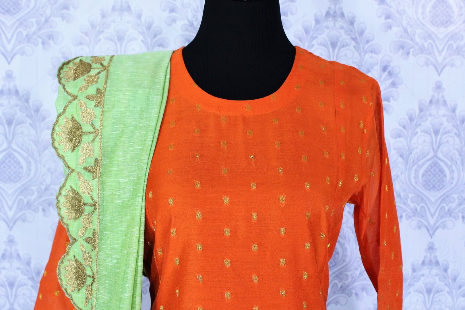 Bright orange embroidered sharara suit with dupatta for online shopping in USA. A beautiful choice for a striking ethnic Indian look at special occasions. Add latest Indian designer dresses to your ethnic wardrobe available at Pure Elegance Clothing store in USA for women.-front