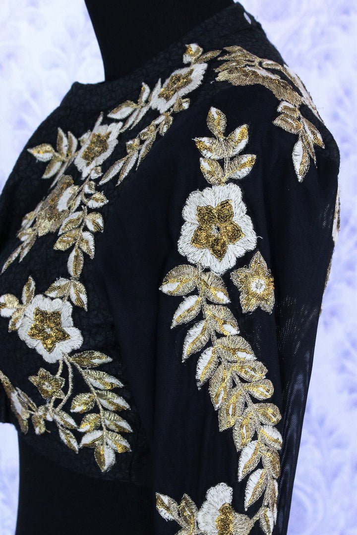 Gorgeous black embroidered designer lehenga buy online in USA. A stunning choice for a striking ethnic Indian look at weddings and special occasions. Dazzle in latest Indian designer wedding lehengas available at Pure Elegance Clothing store in USA for women.-side view