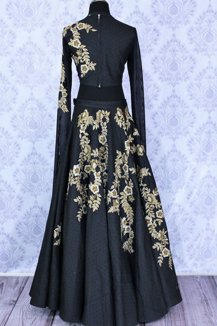 Gorgeous black embroidered designer lehenga buy online in USA. A stunning choice for a striking ethnic Indian look at weddings and special occasions. Dazzle in latest Indian designer wedding lehengas available at Pure Elegance Clothing store in USA for women.-back