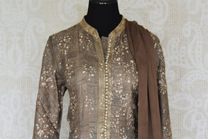 Buy brown printed tussar silk floor length Anarkali suit online in USA with dupatta. The elegant suit is perfect for a classic Indian ethnic look. Make your Indian clothing collection exquisite with beautiful Indian designer Anarkali suits available at Pure Elegance clothing store in USA or shop online.-suit front