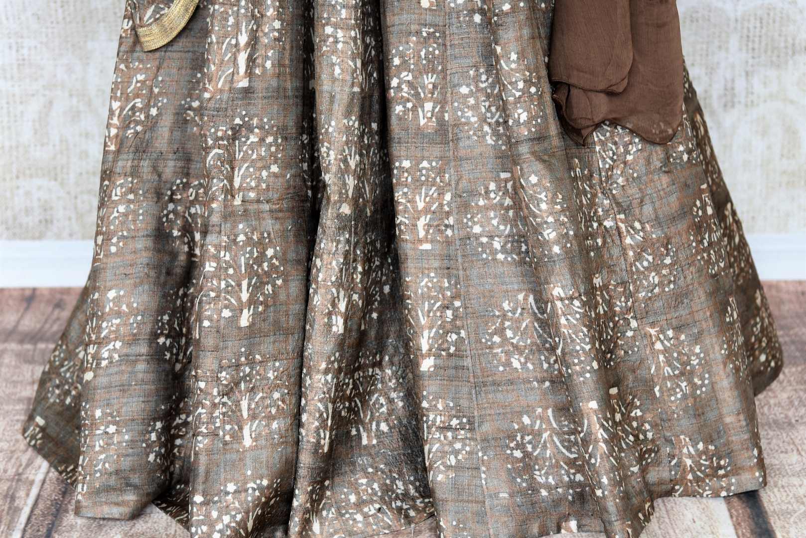 Buy brown printed tussar silk floor length Anarkali suit online in USA with dupatta. The elegant suit is perfect for a classic Indian ethnic look. Make your Indian clothing collection exquisite with beautiful Indian designer Anarkali suits available at Pure Elegance clothing store in USA or shop online.-suit bottom