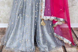 Be a muse in this pretty ash grey silk embroidered designer shararas with a dazzling grey embroidered kurta. The stunning zari embroidery coupled with a contrasting pink embellished dupatta with tassels hanging on its corners looks heavenly. Shop such beautiful Indian dresses, lehengas online or visit Pure Elegance store, USA. - sharara skirt