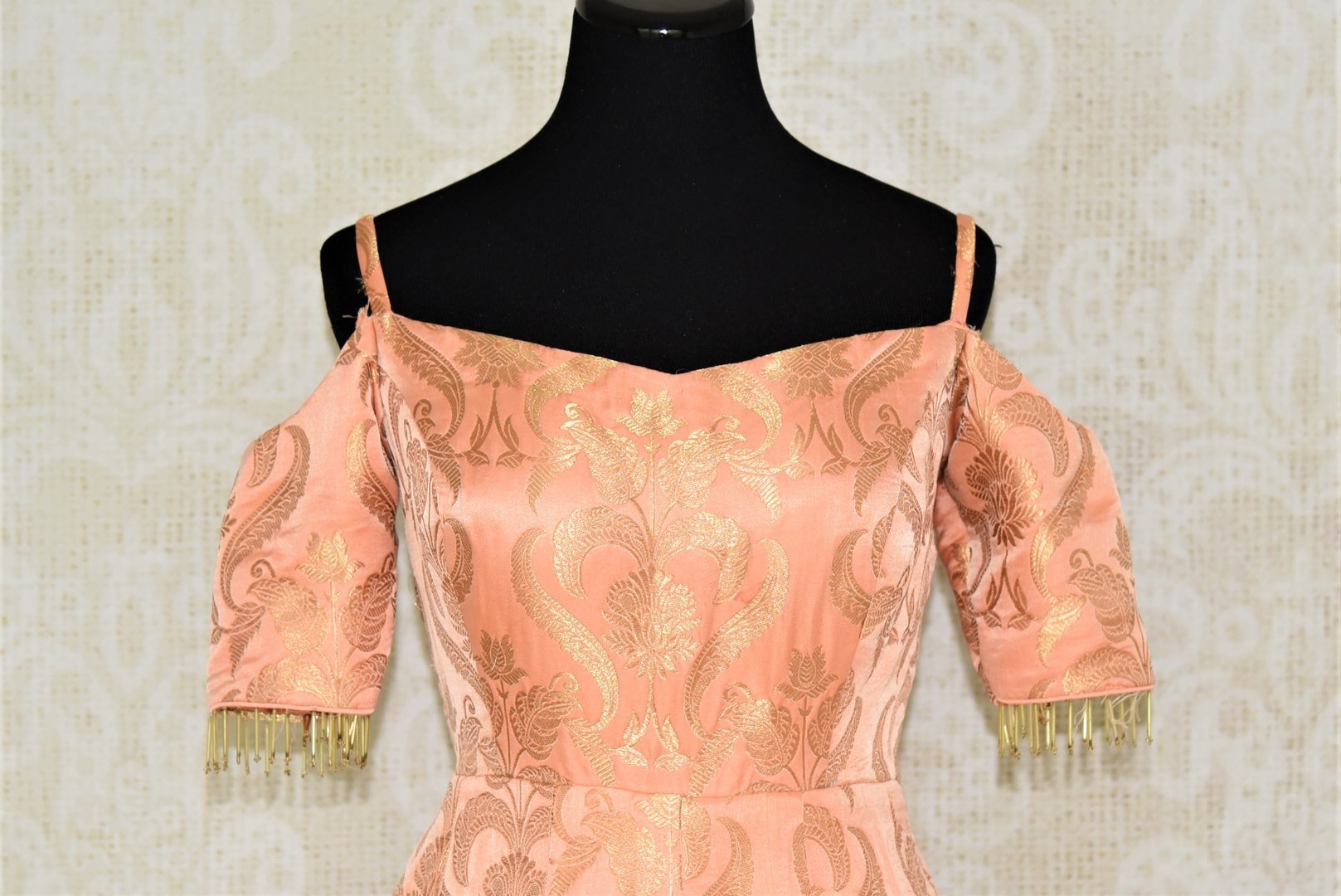 Buy beautiful peach Banarasi silk designer gown online in USA. Add brilliance to your Indian look with alluring Indian designer wedding dresses available at Pure Elegance Indian clothing store for women in USA or shop online.-front