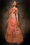 Buy peach raw silk embroidered lehenga with dupatta online in USA. Make your wedding trousseau complete with exquisite Indian designer bridal lehengas from Pure Elegance Indian clothing store for women in USA or shop online.-full view