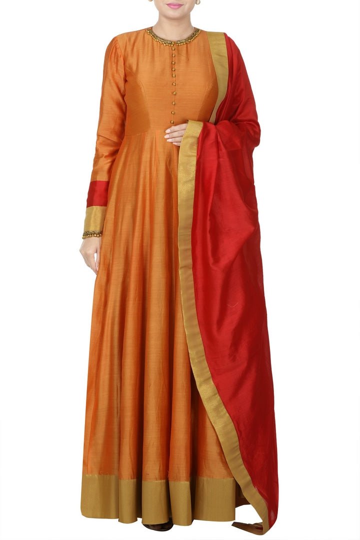 Buy gorgeous orange and red ghungroo embroidery Anarkali suit online in USA with red dupatta. Bring glamor to your Indian style with exquisite Indian designer suits, Anarkali suits, Indian dresses available at Pure Elegance clothing store in USA or shop online.-front