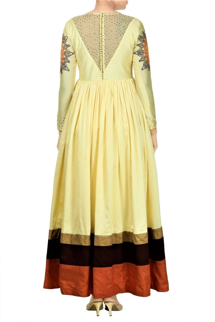 Buy online ivory color floor length Anarkali in USA with embroidered sleeves at Pure Elegance. Make your festive collection exquisite with a range of Indian designer dresses, suits, Anarkali dresses from our exclusive clothing store in USA. You can also browse through our online store and shop online.-back