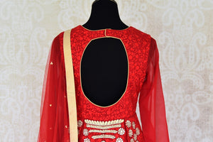Buy red embroidered georgette silk floor length suit online in USA with dupatta. Find a range of Indian designer suits at Pure Elegance clothing store in USA. Keep your ethnic look perfect with a range of traditional Indian clothing, designer silk sarees, wedding sarees, wedding dresses and much more also available at our online store. -back