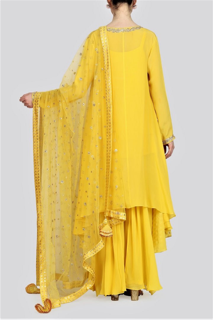 Buy yellow foil print asymmetric kurta with sharara online in USA and net dupatta. For more such gorgeous designer dresses, shop at Pure Elegance Indian fashion store in USA. A beautiful range of traditional Indian sarees and designer clothing is available for Indian women living in USA. You can also shop at our online store.-back