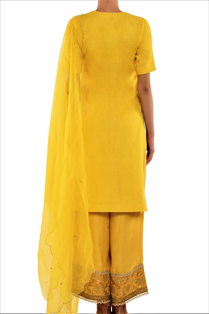 Shop yellow color kurta with embroidered palazzo online in USA. Find a range of Indian designer suits at Pure Elegance clothing store in USA. Keep your ethnic look perfect with a range of traditional Indian clothing, designer silk sarees, wedding sarees, wedding dresses and much more also available at our online store. -back