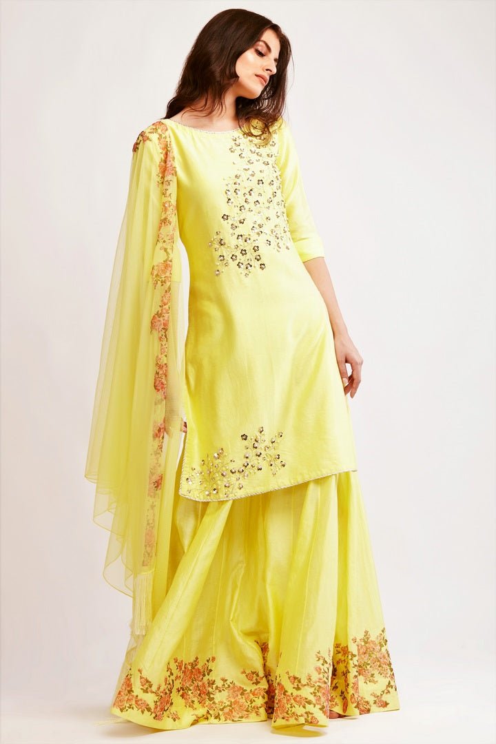 Buy pale yellow chanderi pearl work kurta with sharara online in USA. You can find a fine collection of Indian designer dresses in USA at Pure Elegance clothing store. Our range of traditional Indian clothing, designer silk saris, designer suits,  at our online store is sure to leave you awestruck. -full view