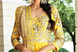 Buy ochre yellow embroidered floorlength kalidar suit with duaptta online in USA. Get occasion ready with a stunning range of Indian designer dresses from Pure Elegance fashion store in USA. Shop from a collection of designer suits, wedding lehengas and Indian clothing for a gorgeous ethnic look from our online store.-closeup