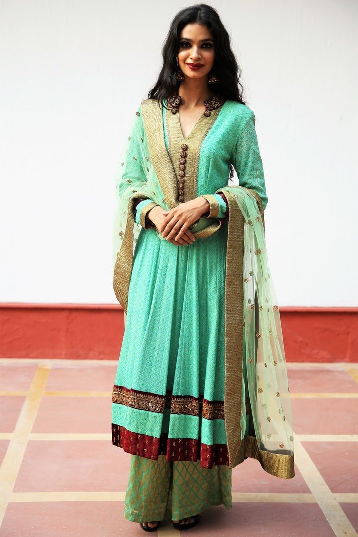 Buy mint green Lucknowi short kalidaar suit with palazzo online in USA with velvet zardozi work. Get occasion ready with a stunning range of Indian designer suits from Pure Elegance fashion store in USA. We bring the best designer dresses for Indian women in USA at our online store. Shop now.-full view