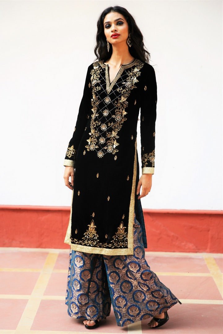 Buy black silk velvet embroidered Afghani inspired kurta with palazzo online in USA. Get occasion ready with a stunning range of Indian designer suits from Pure Elegance fashion store in USA. We bring the best designer dresses for Indian women in USA at our online store. Shop now-full view