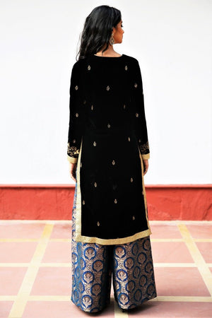 Buy black silk velvet embroidered Afghani inspired kurta with palazzo online in USA. Get occasion ready with a stunning range of Indian designer suits from Pure Elegance fashion store in USA. We bring the best designer dresses for Indian women in USA at our online store. Shop now-back