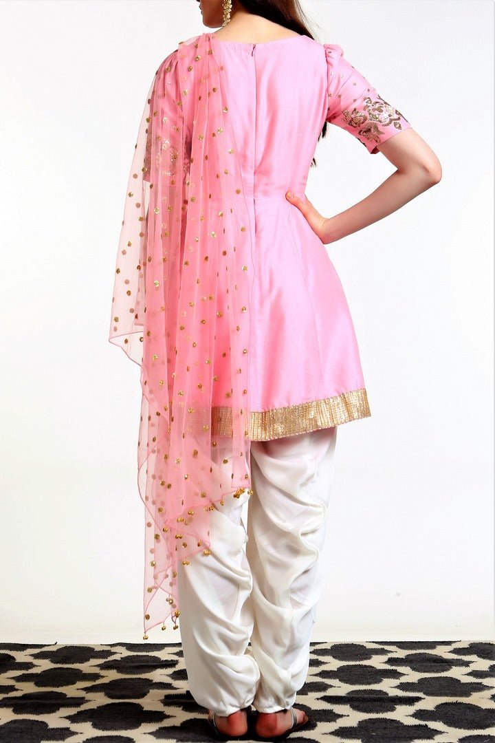 Buy blush pink peplum kurta with white salwar and dupatta online in USA. Get occasion ready with a stunning range of Indian designer suits from Pure Elegance fashion store in USA. We bring the best designer dresses for Indian women in USA at our online store. Shop now.-back