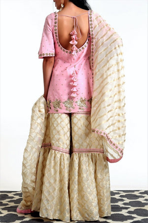 Buy blush pink short kurta with ivory tissue net garara and dupatta online in USA. Get occasion ready with a stunning range of Indian designer suits from Pure Elegance fashion store in USA. We bring the best designer dresses for Indian women in USA at our online store. Shop now.-back
