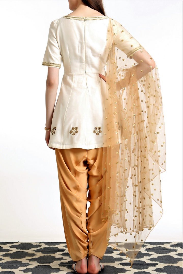 Buy ivory peplum silk blend kurta with gold dhoti salwar and dupatta online in USA. Get occasion ready with a stunning range of Indian designer suits from Pure Elegance fashion store in USA. We bring the best designer dresses for Indian women in USA at our online store. Shop now.-back