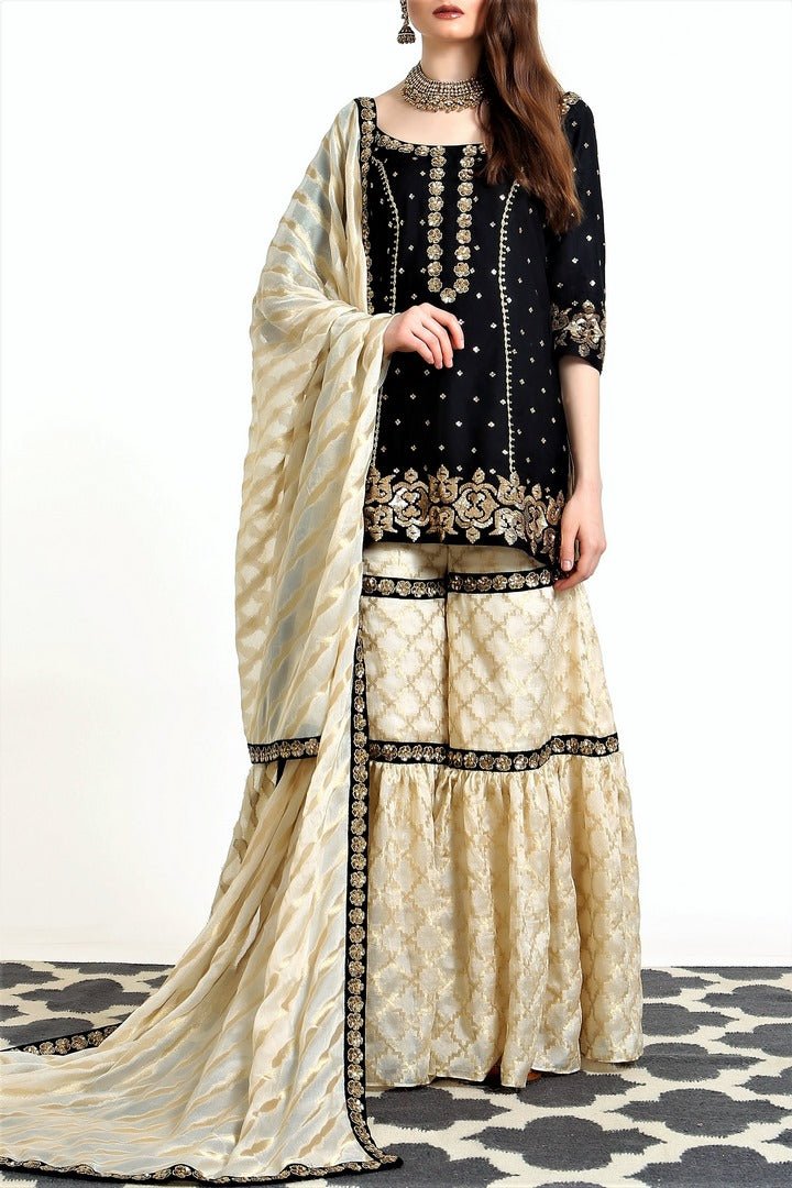 Buy black silk blend short kurta with ivory tissue net gharara online in USA. Get occasion ready with a stunning range of Indian designer suits from Pure Elegance fashion store in USA. We bring the best designer dresses for Indian women in USA at our online store. Shop now.-full view